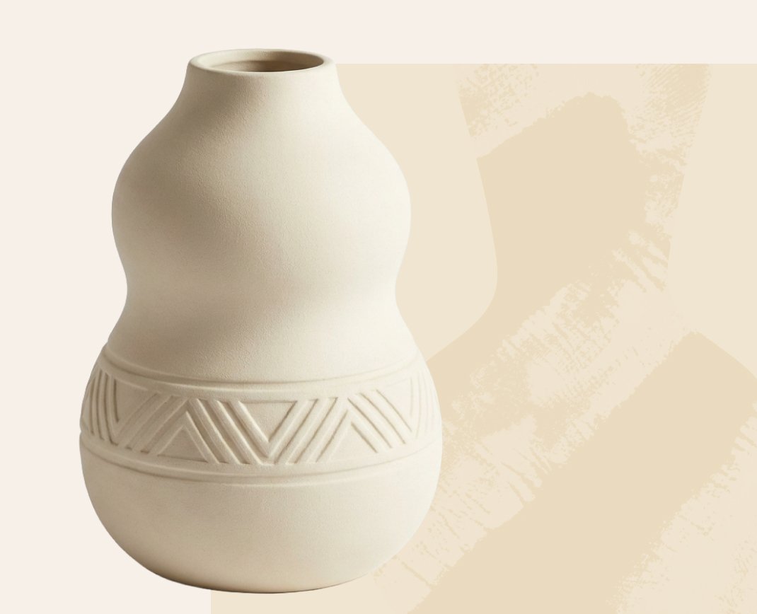 Large cream ceramic vessel with a carved geometric base